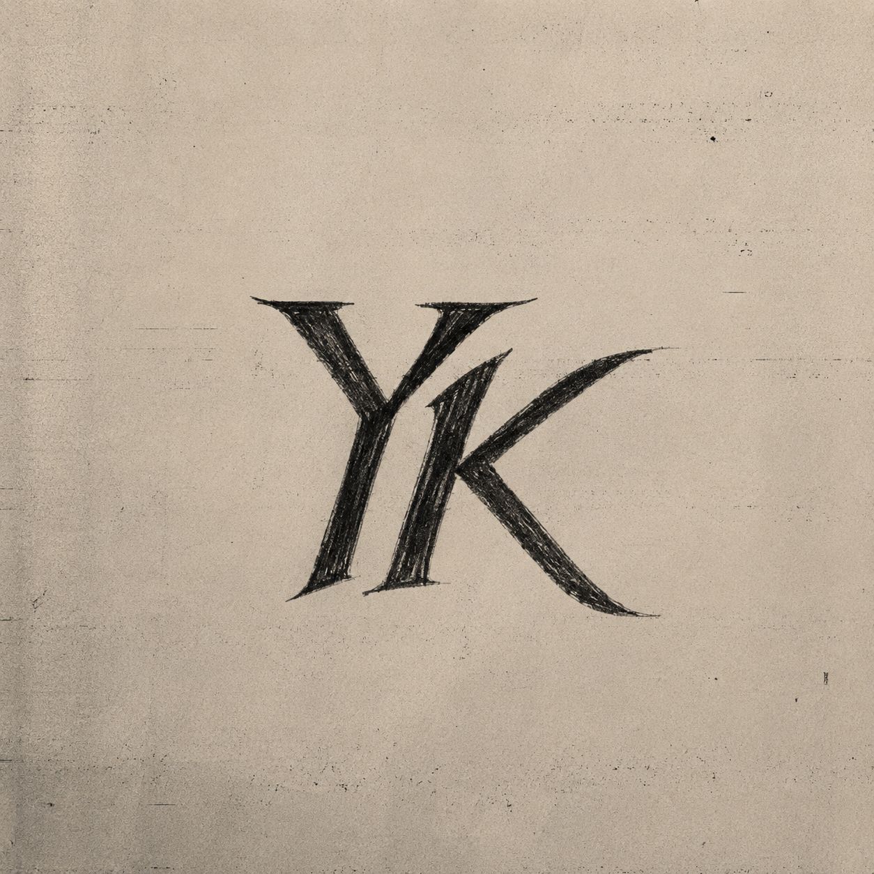 Logo YK con textura vintage sobre papel